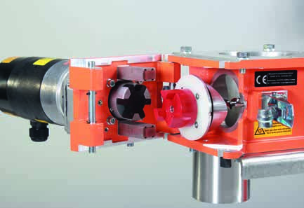 Opened PLASTICOLOR dosing unit showing the motor and coupling area